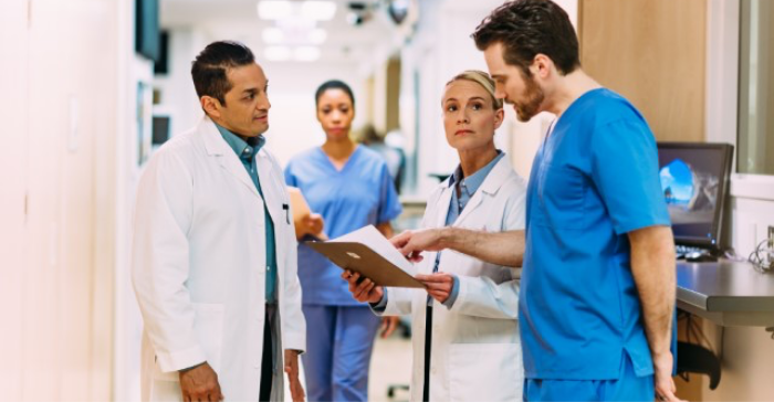 Doctors discussing patient's files