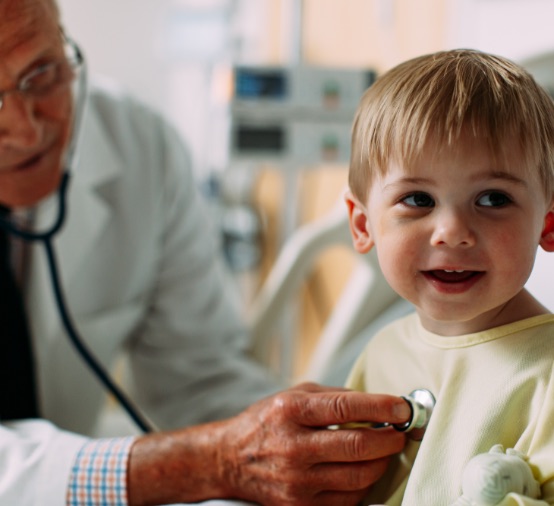 Doctor examining pediatric patient