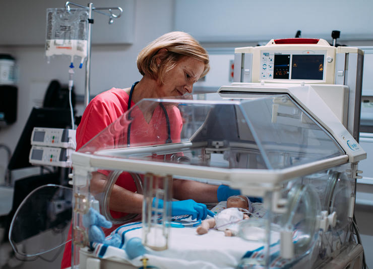 Nurse with neonatal patient
