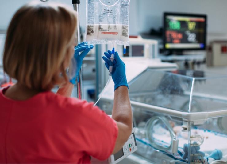 Women in hospital with PN bags
