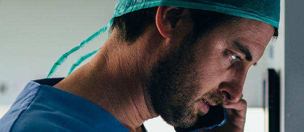 Male doctor on phone