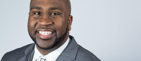 Black male wearing business attire